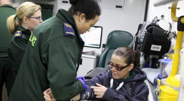 Photo of North West Ambulance Service paramedics attending a patient